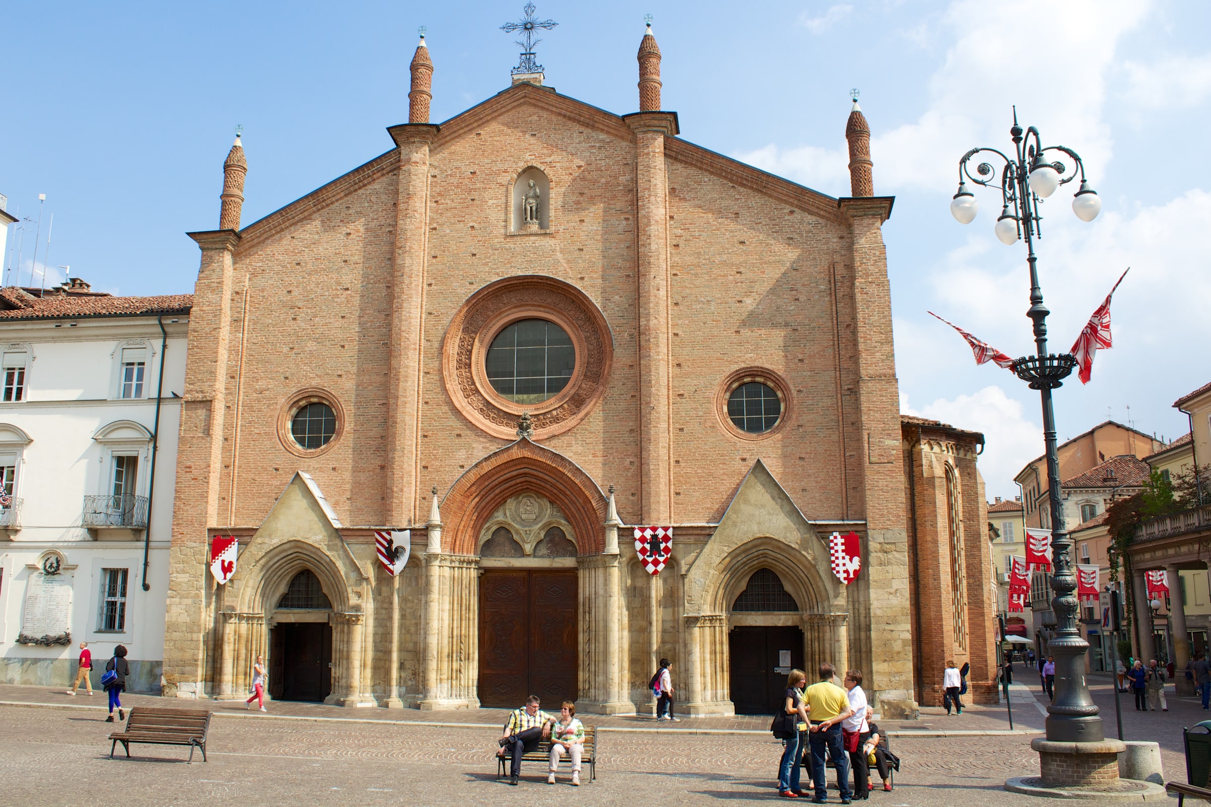 Brick Gothic façade of the Collegiata di San Secondo on its civic square in Asti.