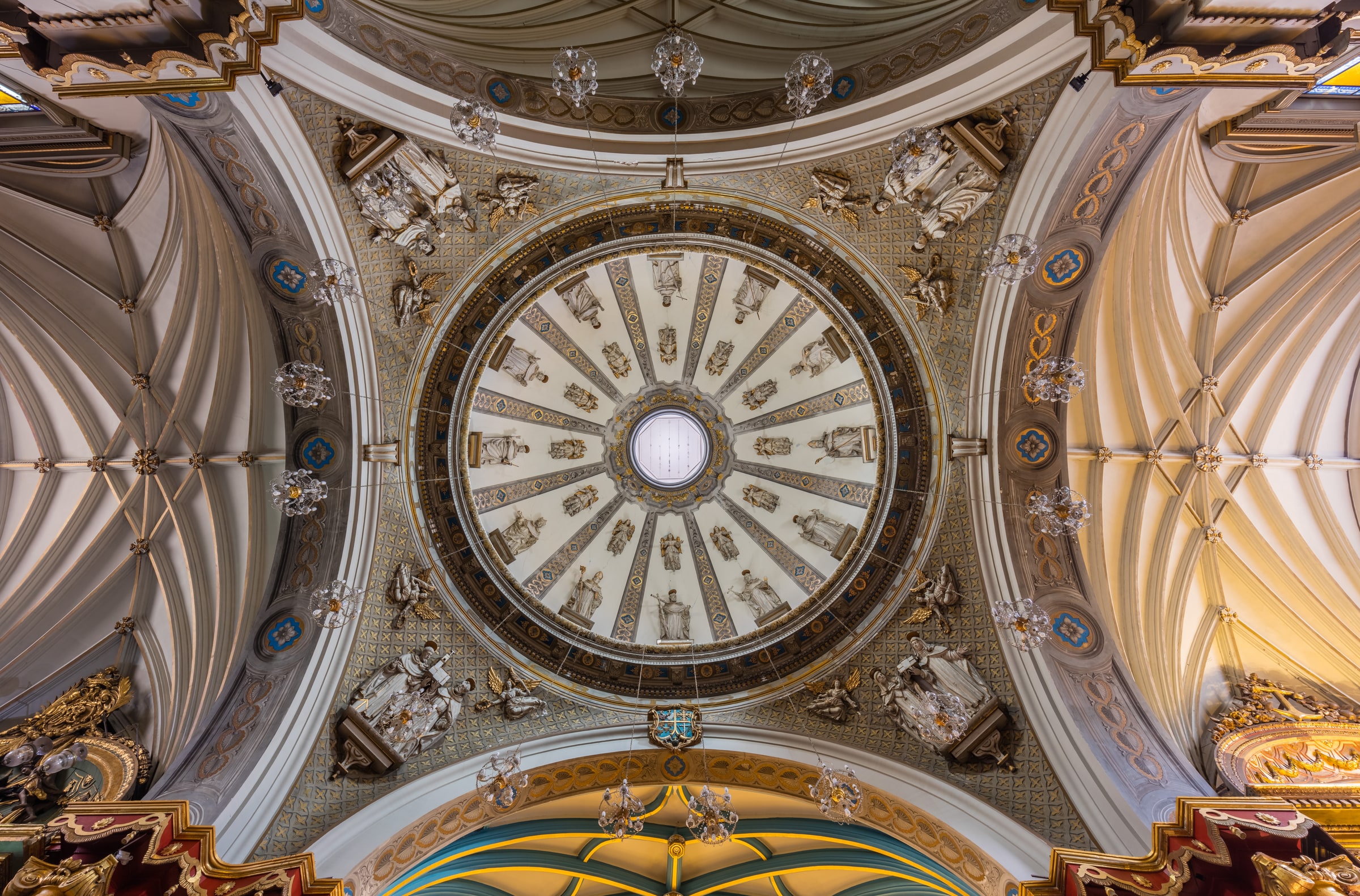The decorated interior and dome of the Basilica and Convent of Santo Domingo in Lima, Peru.