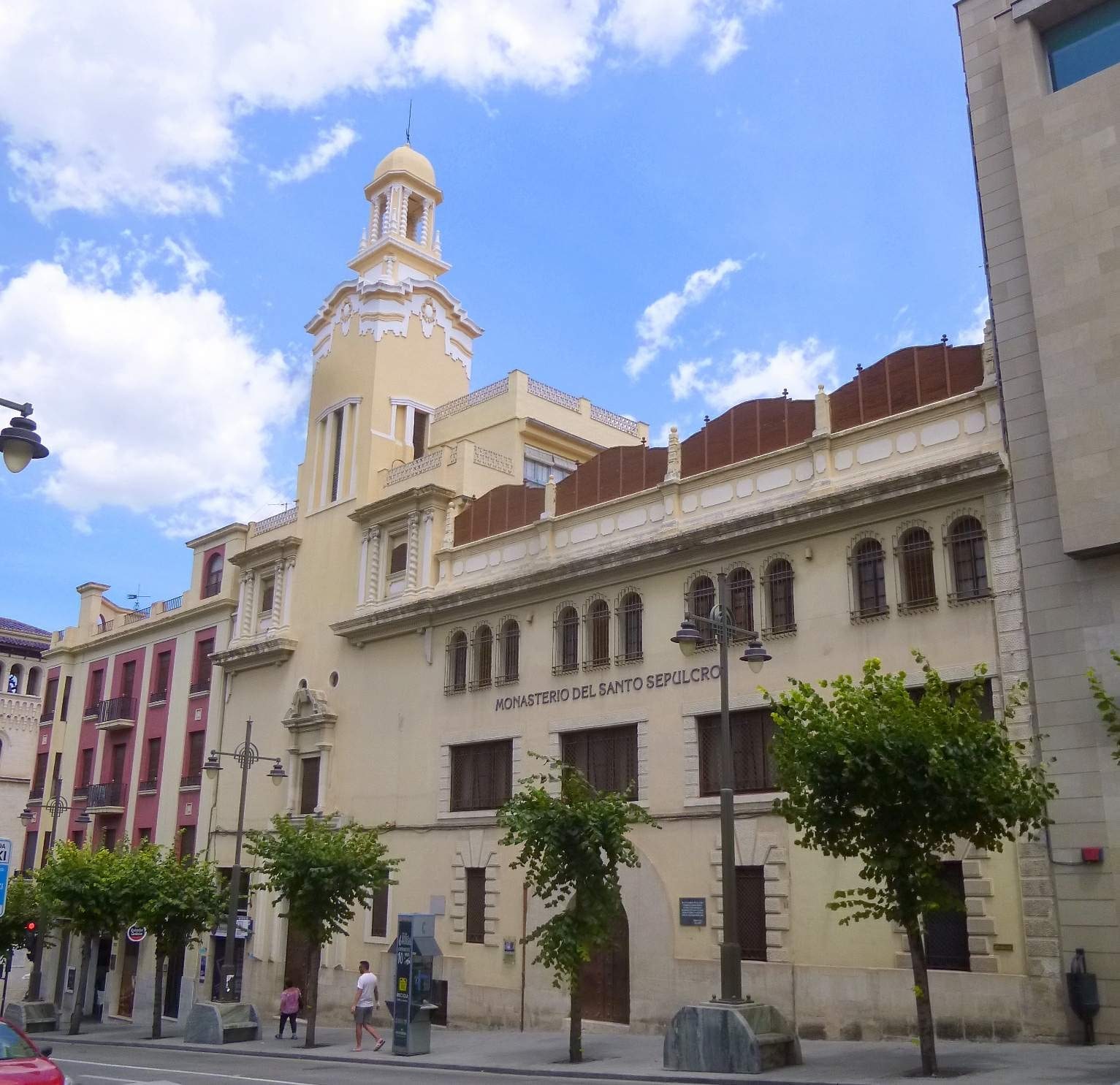 Street façade and bell tower of the Monastery of the Holy Sepulchre in Alcoy, Spain.