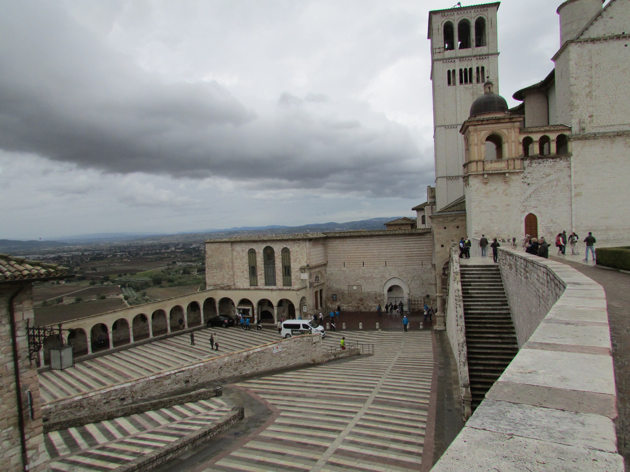 The Basilica of St. Francis and the friary complex rising above Assisi, Italy.