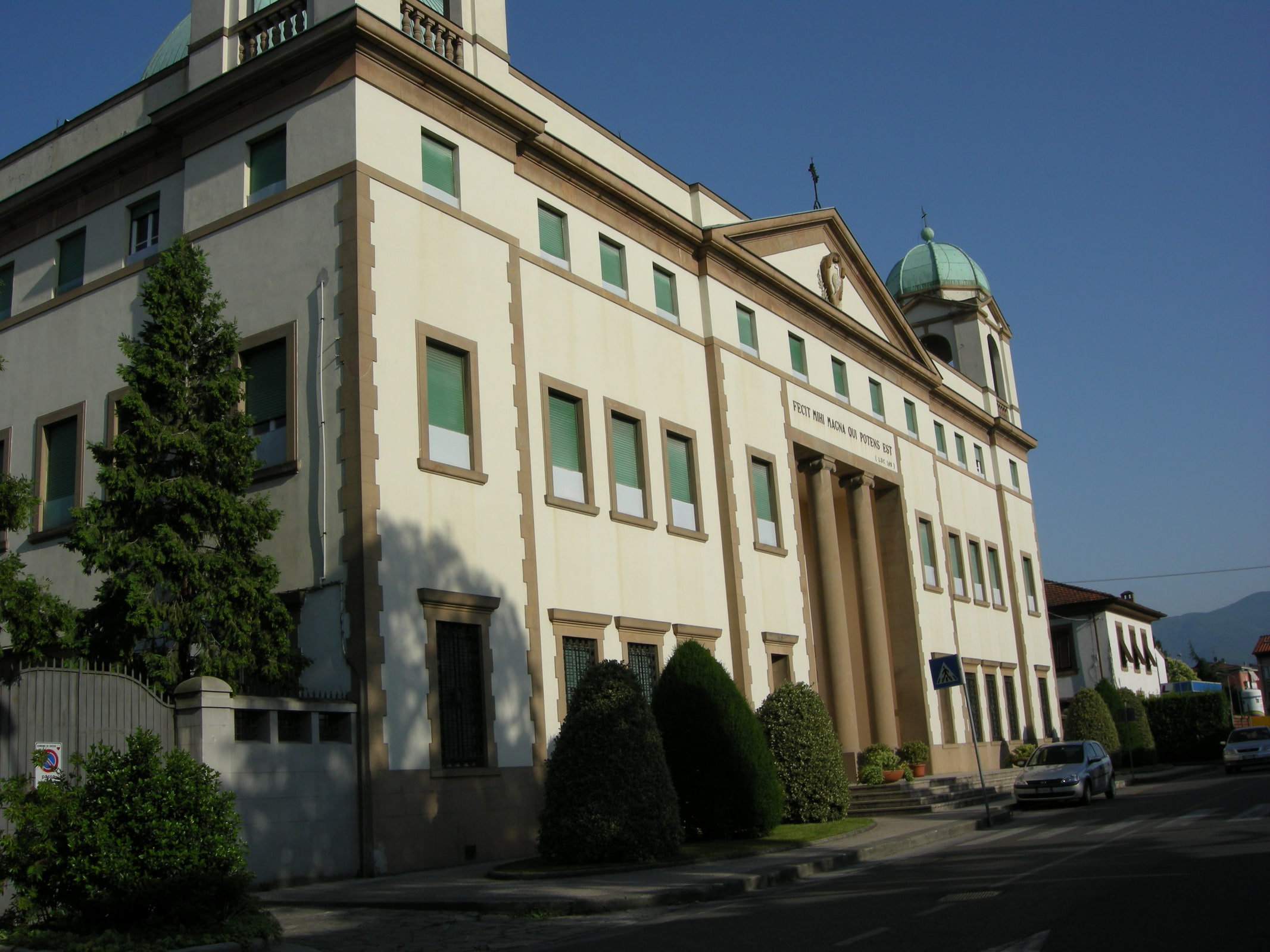 The pale stone facade and dome of the monastery-sanctuary of St. Gemma Galgani in Lucca.