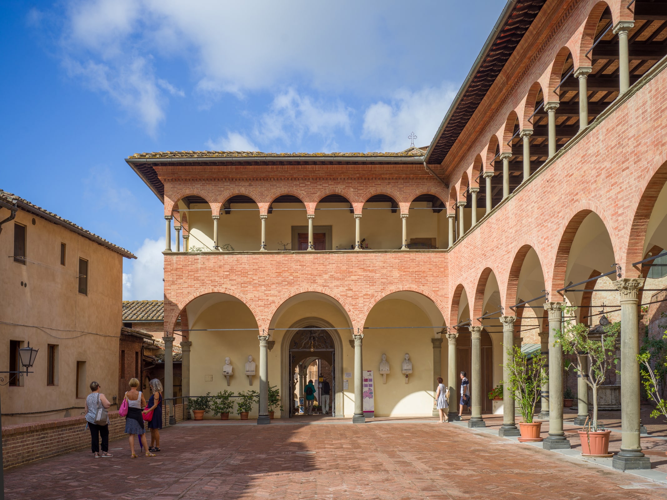 The Renaissance portico and courtyard entrance of the Sanctuary-House of St. Catherine in Siena.