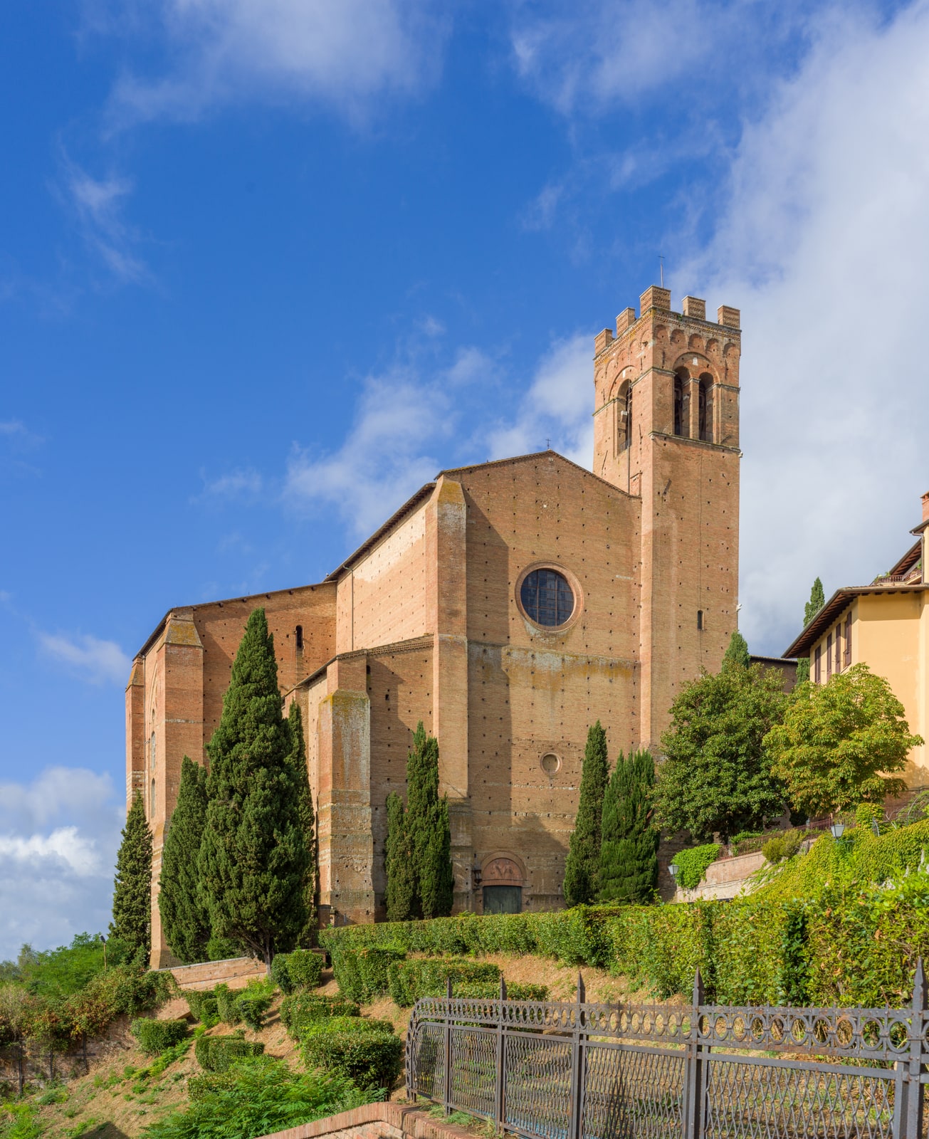 The massive brick Basilica of San Domenico on its hill above Siena.