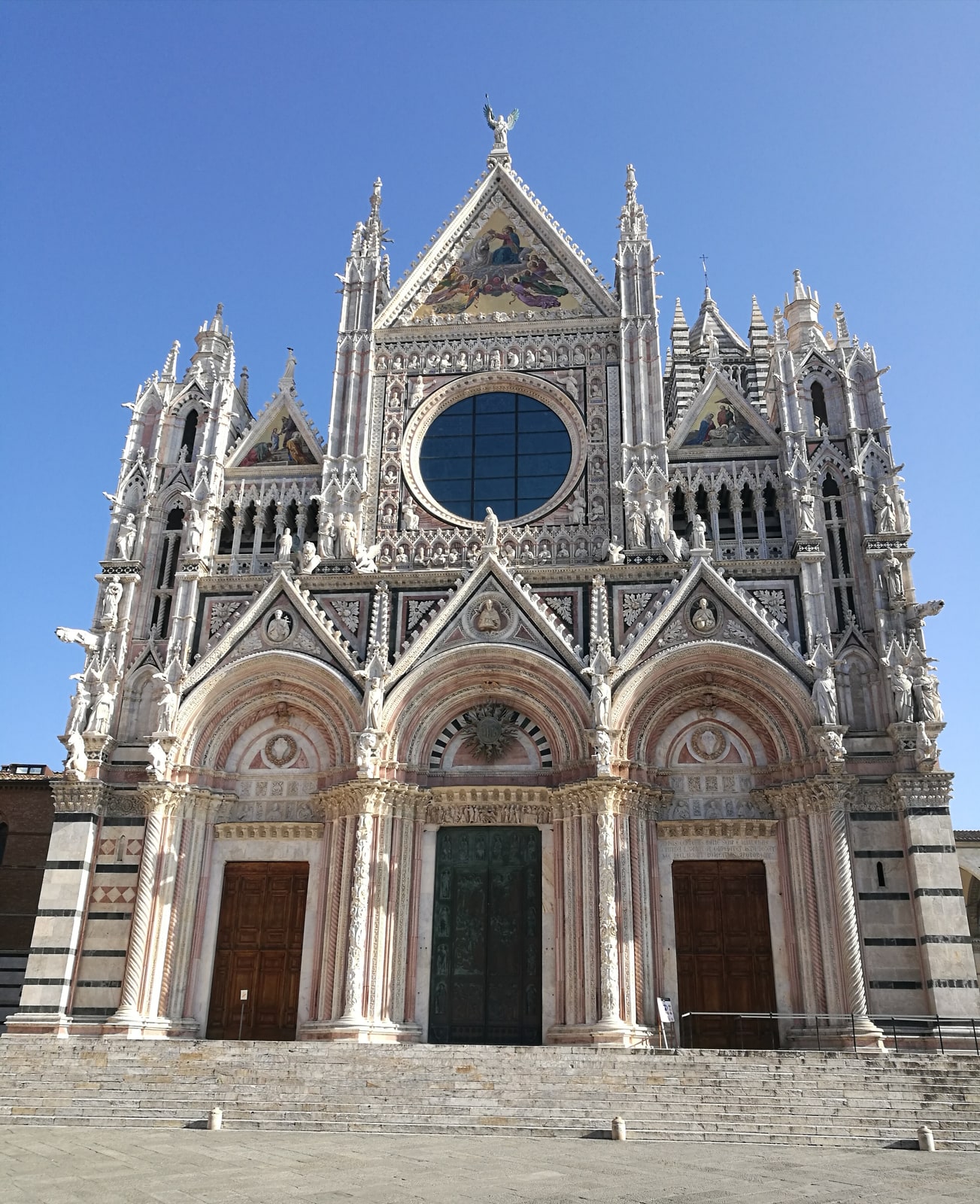 The sculpted marble facade of Siena Cathedral of Santa Maria Assunta.