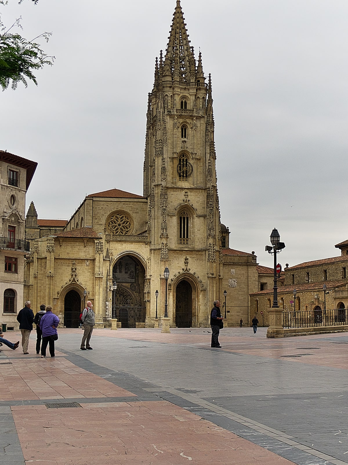 The Gothic facade and tower of Oviedo Cathedral seen from Plaza Alfonso II el Casto in Asturias, Spain.