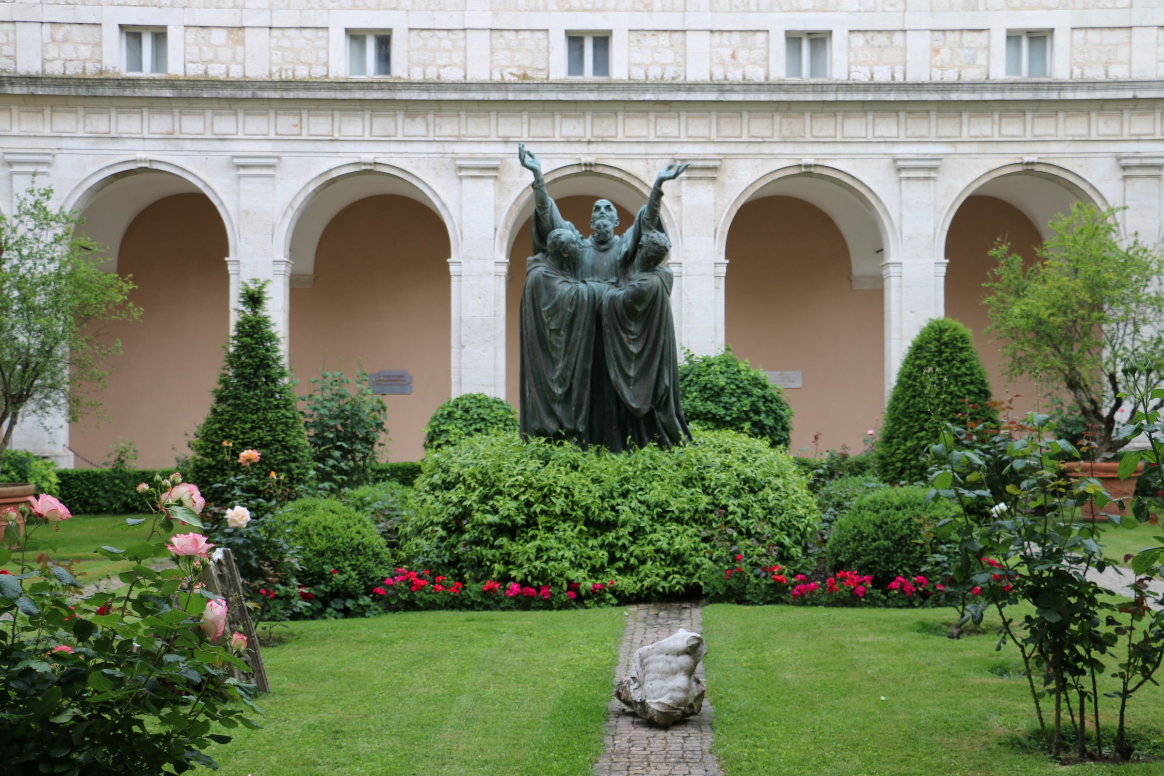 The pale stone Abbey of Montecassino and its green dome rising above the mountain near Cassino, Italy.