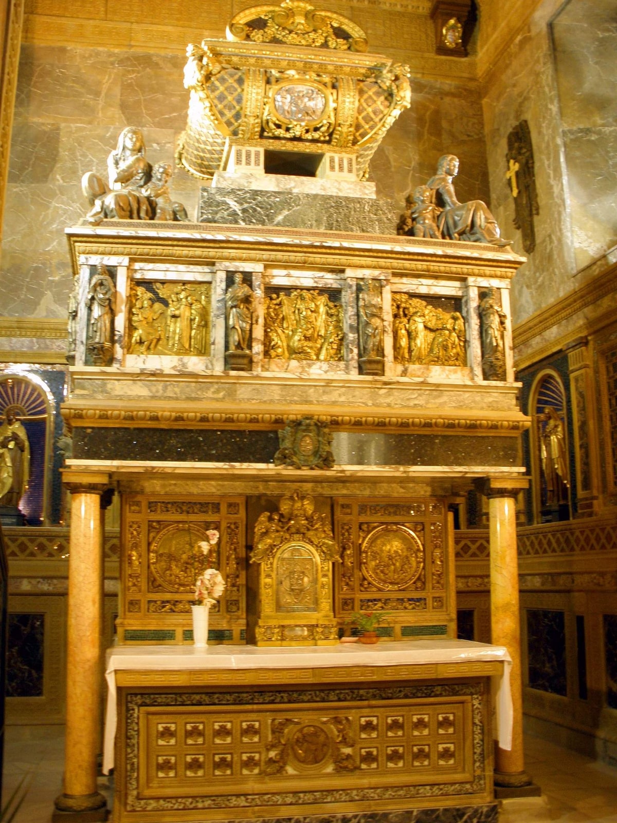 The marble-and-bronze sepulcher of St. John of the Cross in the Discalced Carmelite convent at Segovia.
