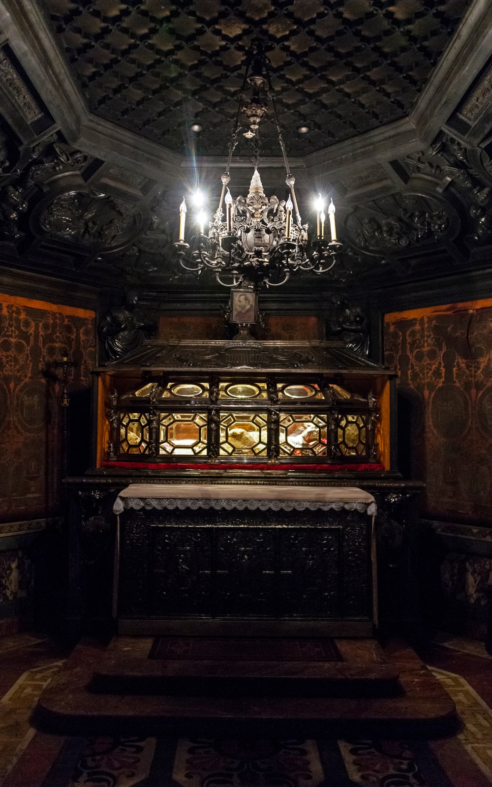 The crystal-and-silver urn of St. Charles Borromeo in the Scurolo beneath Milan Cathedral.