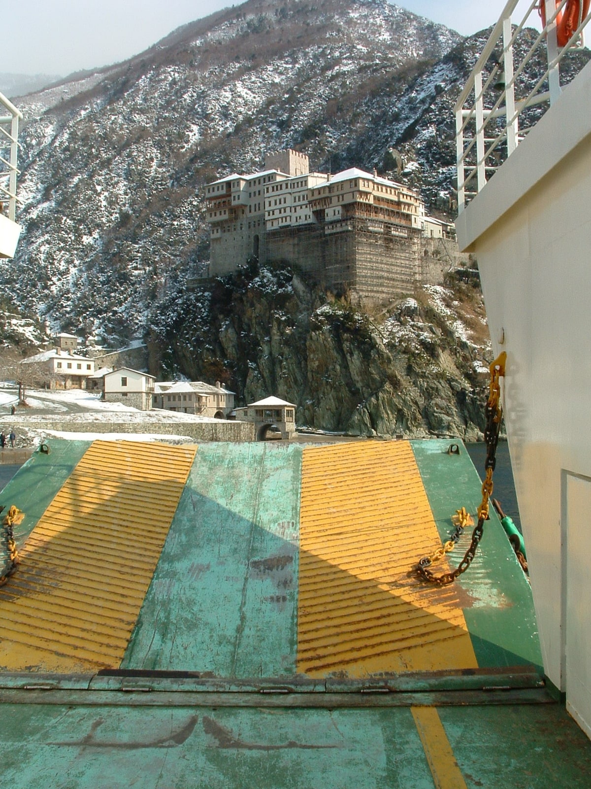 The cliffside Holy Monastery of Dionysiou rising above the Aegean Sea on Mount Athos, Greece.